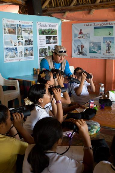 Diego with a group of Rio Lagartos grade school students in a bird identification class