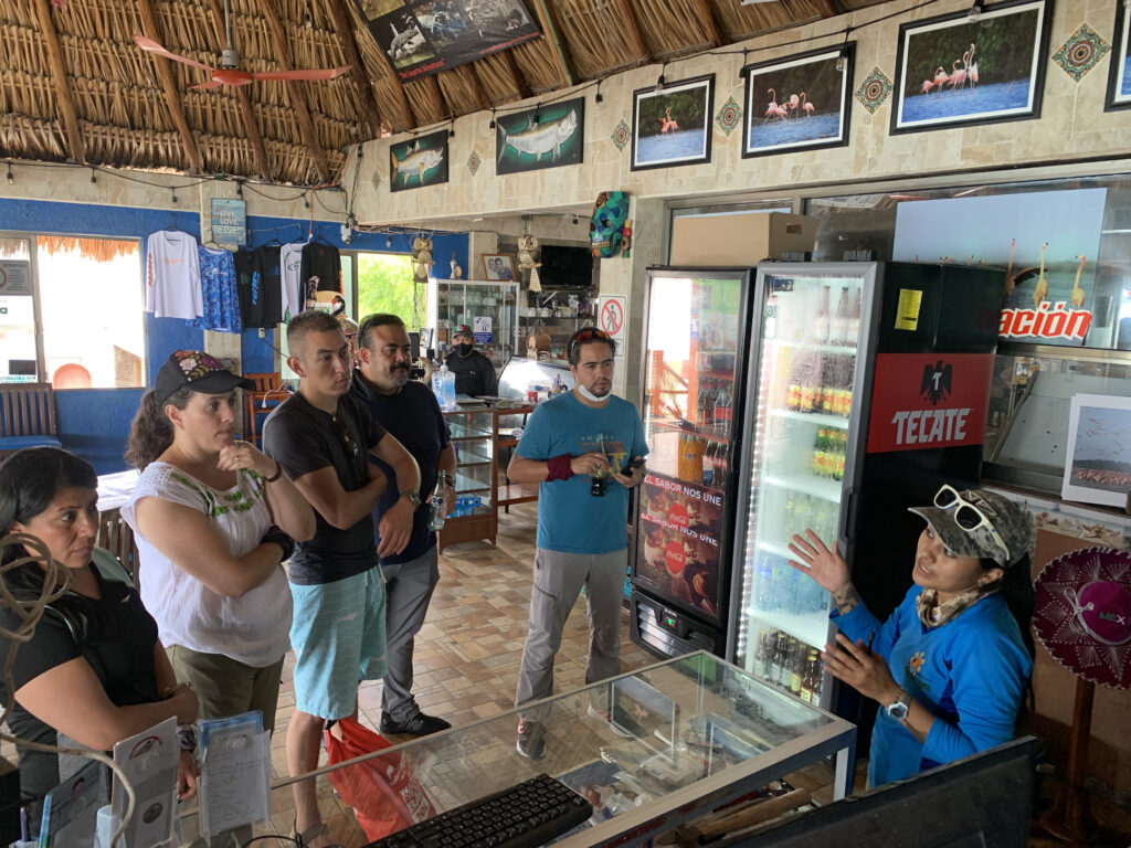 Andrea explaining the tour options at Rio Lagartos Adventures located at Ria Maya Restaurant